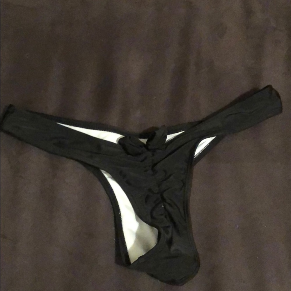 Black swim thong bottoms with bow